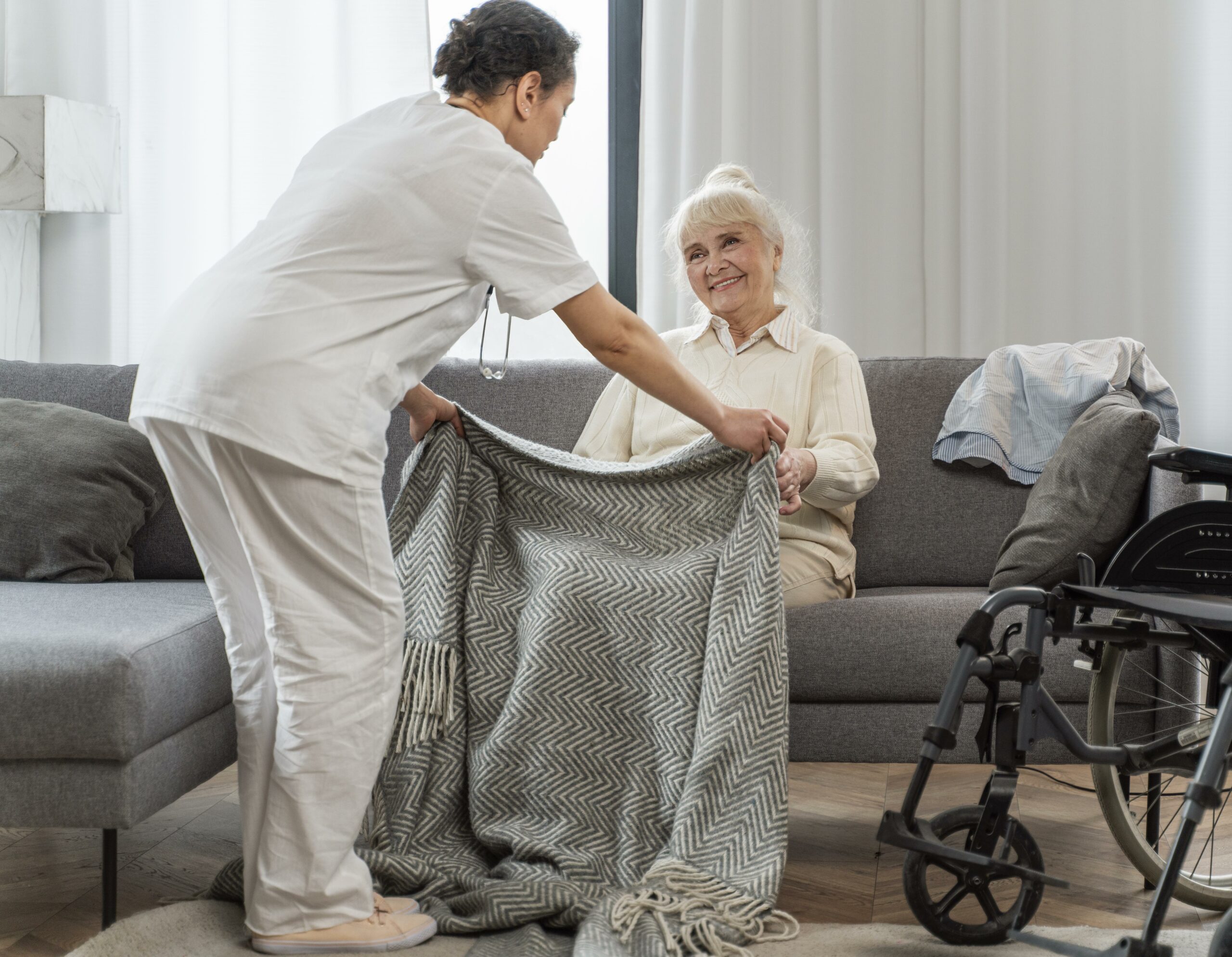 doctor taking care senior woman home scaled